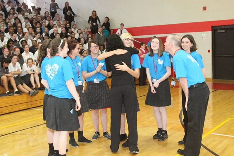 Jodee Blanco with a group of Catholic school students