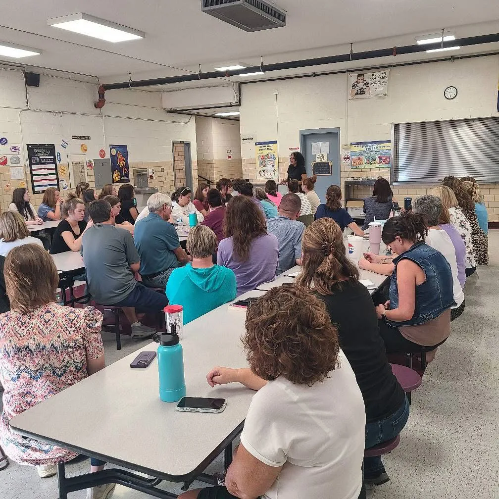 Jodee Blanco presenting to students in a cafeteria
